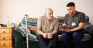 social worker assisting older patient